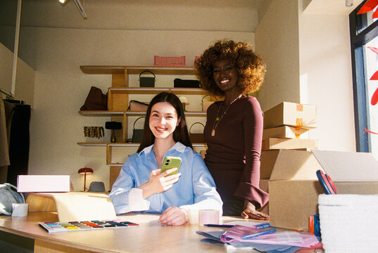 Woman Smiling in Small Business Workspace on Film Photo