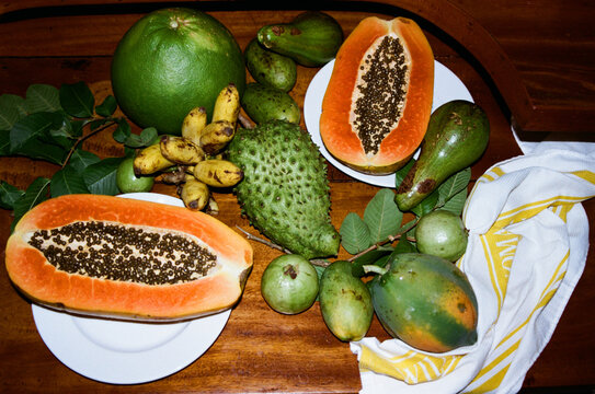 Fresh fruits on a wooden table in a kitchen