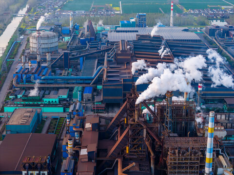 Aerial view of steel plant with blast furnaces and smoke stacks