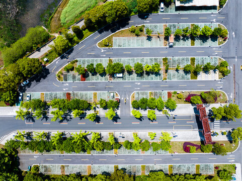 Aerial view of urban park with tree-lined pedestrian promenades