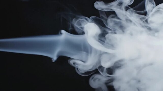 White tobacco smoke line cloud moves against black background in a simple display of smoke patterns