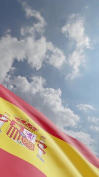 Spanish Flag Waving Against Blue Sky and Clouds Background