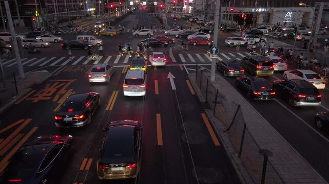 Evening Rush Hour Traffic at Busy Urban Intersection in Beijing, China