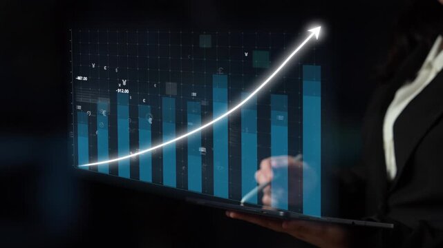 A businesswoman showcases financial growth data on a laptop screen featuring a rising graph with digital icons, illustrating trends in the global economy. Copula