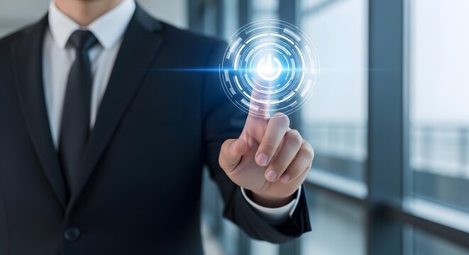 Man in suit touching glowing power button interface