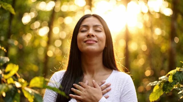 Cheerful woman feeling positive energy in sunny green forest perfect for mental wellness and harmony purpose