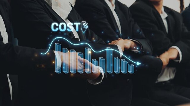 Professionals engage in a business meeting, analyzing a graphical representation of cost reduction strategies. The environment promotes collaboration and success. Raster