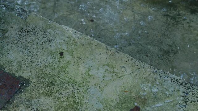 Rain on floor wall cement street, effect storm fall rainy absatract nature spash on grey concrete, blur drop water background, environment ecosystem or broken heart concept.