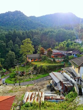Serene Rural Village Nestled Among Lush Forested Hills In Tegal Indonesia