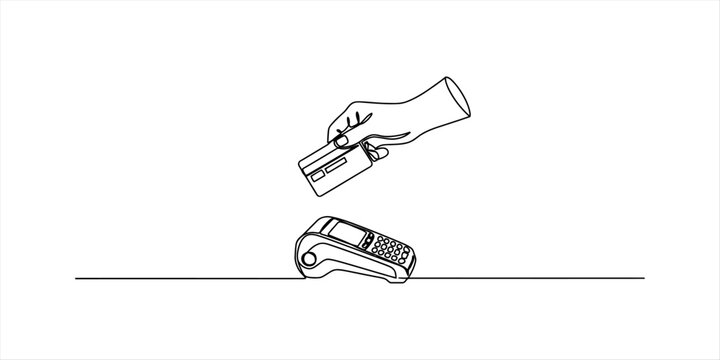Hand holding credit card near payment terminal