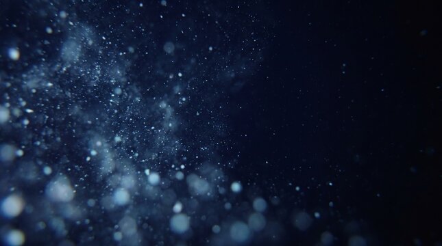 Deep-sea particle drift underwater with bubbles suspended in dark blue ocean depths