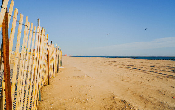 Coney Island beach in Brooklyn, New York City, with Atlantic shoreline and sandy winter coast.
