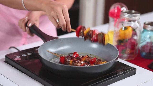 Preparing Marinated Beef Satay with Fresh Vegetables on Wooden Skewers.