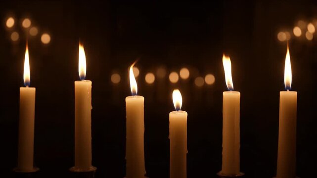 Horror candle flame candlelight dark night glowing warm romantic spiritual peaceful atmosphere with soft bokeh light reflection calm tranquil mood wax row shadows and burning lights creating peaceful