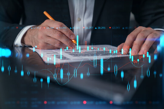Woman typing on laptop at office workplace in background. Concept of working process, internet surfing, online business education. Student send e-mail. Close up view. Hands Shot. Stock market chart