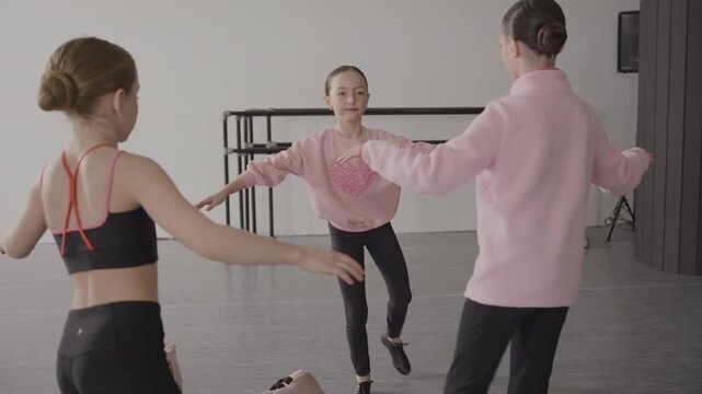 Group of young female tap dancers in a modern dance studio