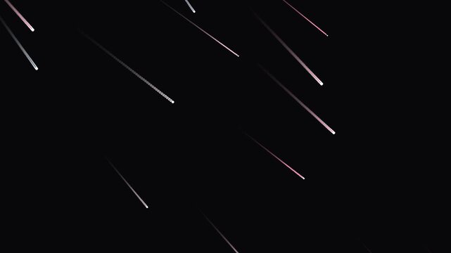 Abstract shooting stars falling rapidly across a dark night sky, creating dynamic light trails and a mesmerizing meteor shower effect, perfect for backgrounds and overlays.