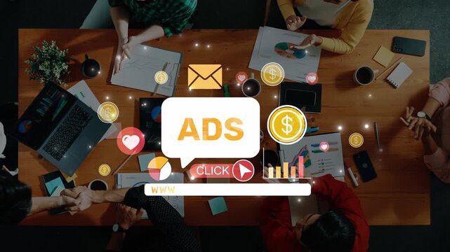 A diverse group of professionals collaborates on innovative marketing strategies at a table with digital advertising elements enhancing their discussion and planning. Raster