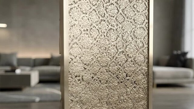 Medium shot highlighting textured ornamental metal screen with embossed surface details adding tactile interest and elegance to a stylish room.
