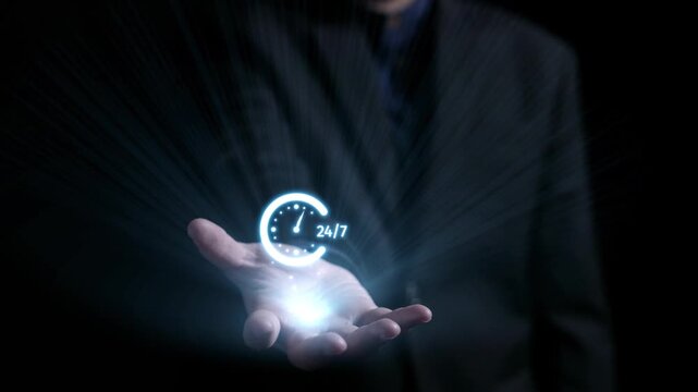 A hand holds a glowing digital clock icon with 24 hour written on it, symbolizing constant availability and modern communication tools in a dynamic business setting. Qubit