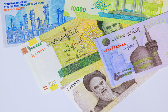 Stack of Iranian IRR rial cash banknotes representing official currency of Iran.