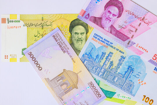 Assorted Iranian rial cash banknotes used as official currency in Iran.