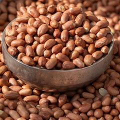 Obraz premium Close up of raw peanuts filled in metal bowl at South Korea traditional market.
