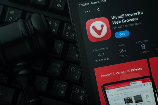 Dhaka, Bangladesh- 28 Oct 2025: An iPad displaying the Vivaldi Browser app against a judge's gavel and dark keyboard background.