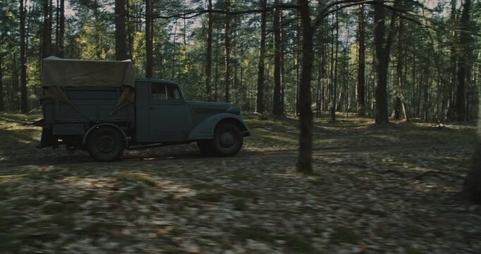 Vintage WWII German military truck parked in forest