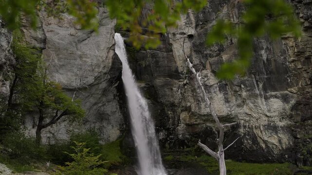 Chorrillo del Salto waterfall near El Chalt&eacute;n, Santa Cruz Patagonia, Argentina, flowing through rocky canyon walls with lenga forest vegetation and glacial meltwater runoff, slow motion forward dolly