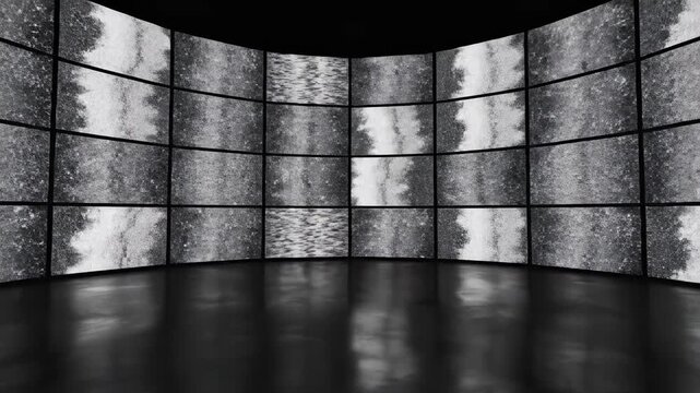 Futuristic Video Wall Display with abstract black and white noise textures on a curved screen array in a dark studio ideal for high-tech presentations and cinematic backgrounds.