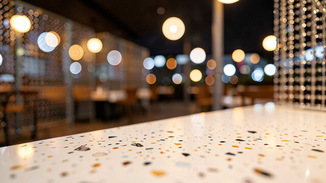 Terrazzo Tabletop With Embedded Marble Flecks on Chic Rooftop Lounge with Ambient Warm Uplighting Lu