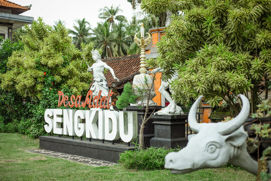Entrance sign to the traditional Balinese village of Desa Adat Sengkidu, located in the Karangasem Regency in eastern Bali, Indonesia, December 3, 2025.