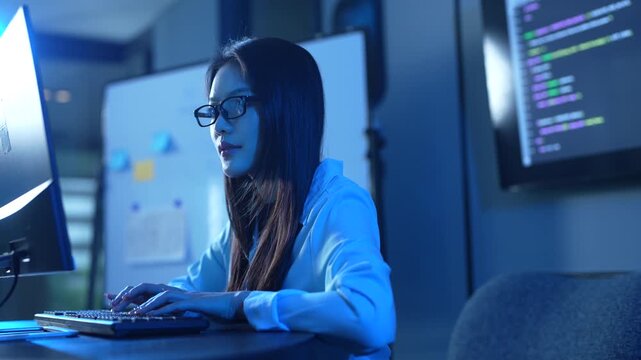 Programmer professional female working on software development, Asian IT developer coding for SaaS platform and cybersecurity network, Modern technology and computer programming business concept