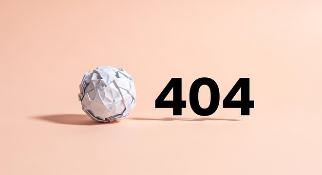 Crumpled paper ball next to a printed 404 error