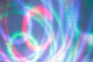 Abstract colorful light streaks on a fine textured grid background © 2xwilfinger
