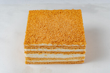 Obraz premium Delicious layered dessert with crispy texture and creamy filling, perfect for any celebration