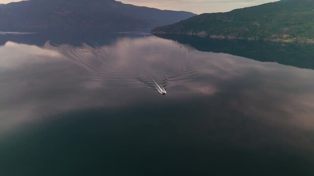 Lone Boat on Mirror Calm &Aring;krafjorden near Langfossen Waterfall, Norway