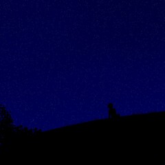 Fototapeta premium Starry Night Sky Panorama with Lonely Human Silhouette and Nature Landscape