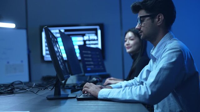 Coding team, Professional IT specialist and programmer working on software development, Male developer talking with female colleague about computer code, Modern and technology collaboration concept
