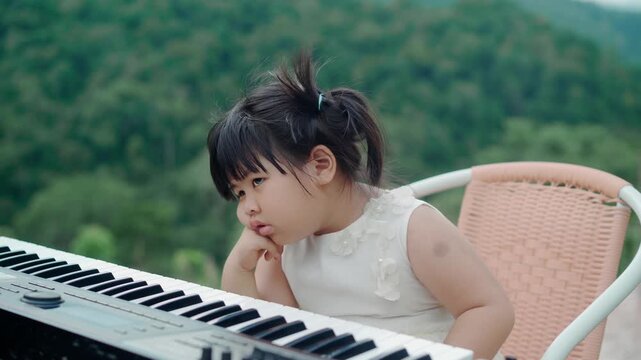 Asian Preschool Girl Showing Bored and Upset Facial Expression
