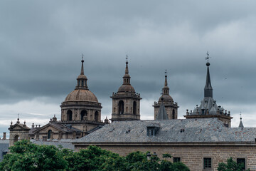 Obraz premium El Escorial monastery spires under a dramatic sky