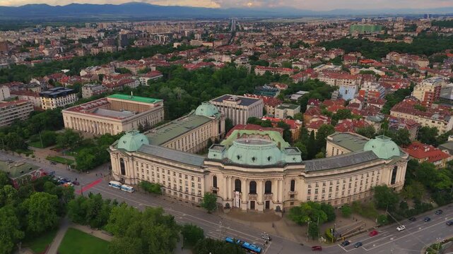 High angle drone view of the historic Bulgarian Academy of Sciences building and adjacent park square in central Sofia city, Bulgaria