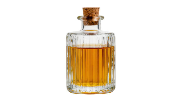 Clear glass decanter with ribbed texture filled with amber liquid and cork stopper