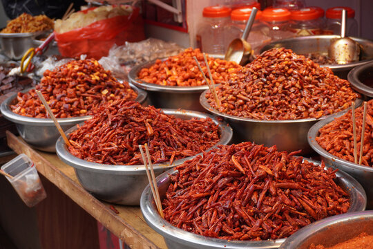 A taste of Guizhou. Bold and spicy local chili dishes at the historic Qingyan Ancient Town market, China.