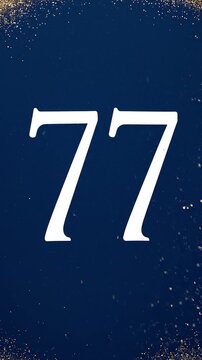 Gold Glitter Blow‑Away Reveal of Number 77 on Solid Background