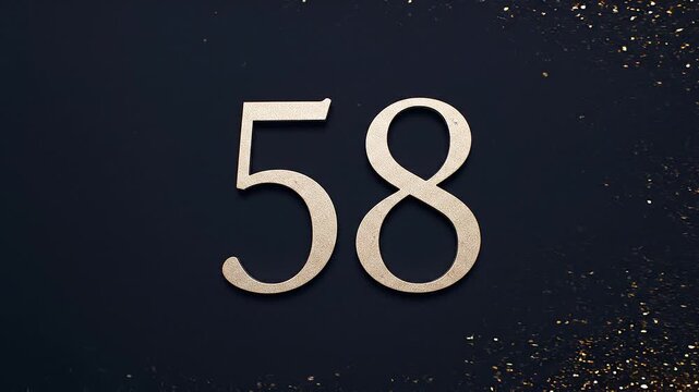Gold Glitter Blow‑Away Reveal of Number 58 on Solid Background
