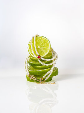 Pearl bracelet with red heart on stacked lime slices