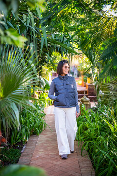 beautiful woman exploring a garden in Marrakesh