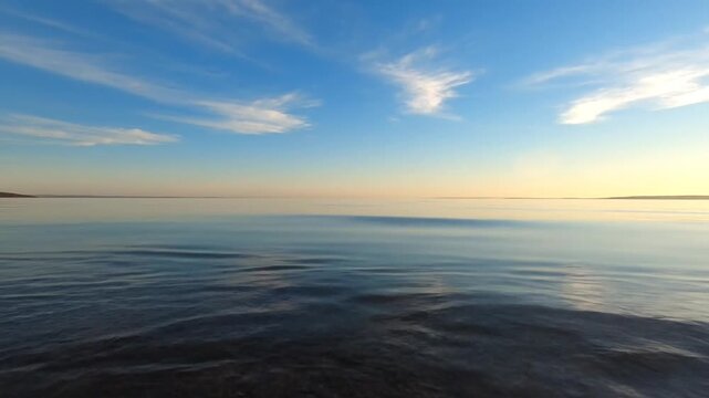 Calm ocean water at sunset.